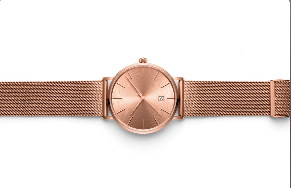 Rose gold mesh bracelet watch on white background