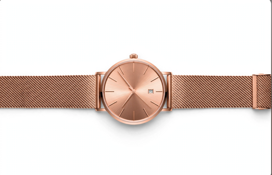 Rose gold mesh bracelet watch on white background