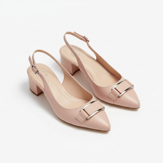 Blush pink slingback pumps on white background