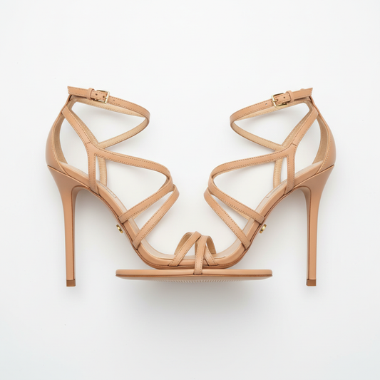 Nude strappy heeled sandals on white background