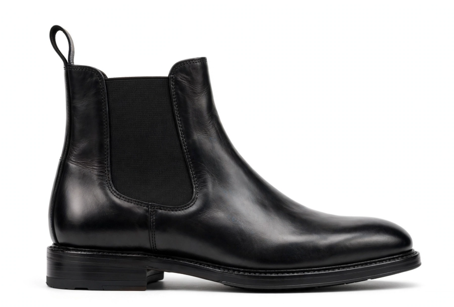 Black leather chelsea boot side profile on white background