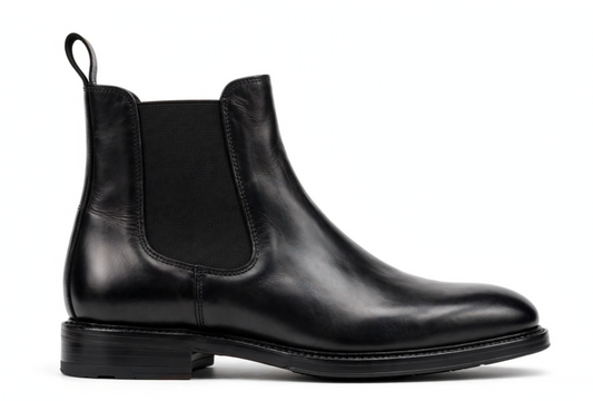 Black leather chelsea boot side profile on white background